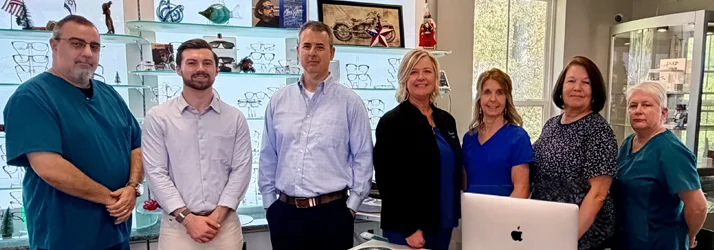 Drs. Benjamin Bittner and Sean McEntee with the Human Eyes Vision Center team